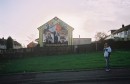 Katie B and the Mural * Katie B looks away from a nationalist mural. * 1536 x 1002 * (309KB)